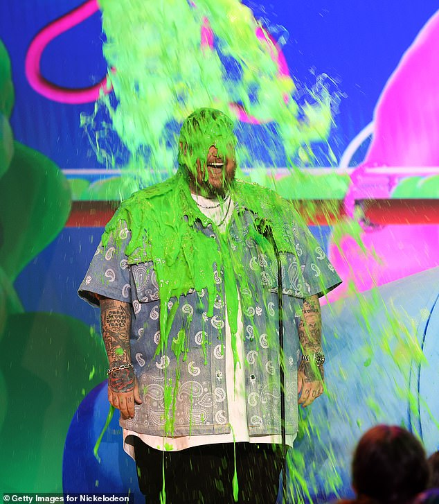 The musician looked ecstatic as he was sprayed with the iconic green slime