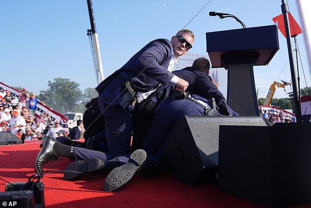 Secret Service raced to the stage to protect Trump after shots were fired