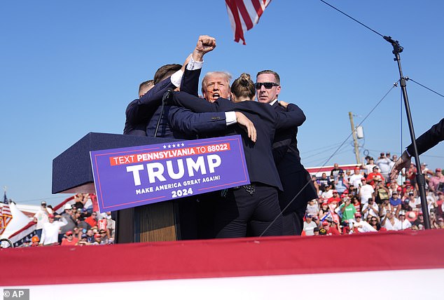 U.S. Secret Service escorts Trump off stage after the gunfire directed towards him