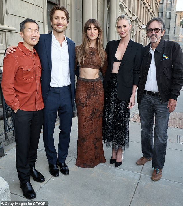 Later in the evening, Glen Powell and Daisy Edgar-Jones paused for a group photo with Theron as well as Lee Isaac Chung and Patrick Crowley