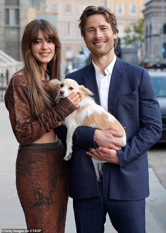 At one point, the pair were also spotted holding an adorable pup in their arms during the photo session