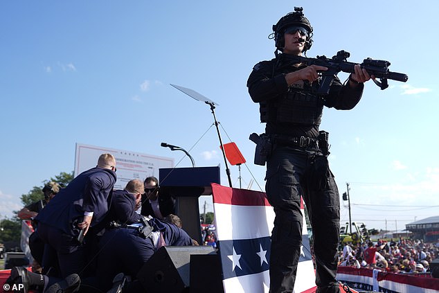 Several heavily armed officers lined the perimeter and ordered attendees to 'get down'