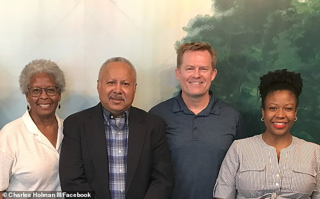 Charles Holman is seen with his family members and President Bush's cousin Kurt