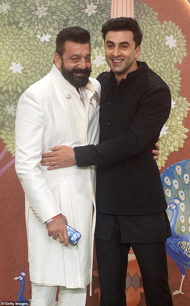 Sanjay Dutt (pictured left) and Ranbir Kapoor (pictured right) were cheerful as they posed for a photo together