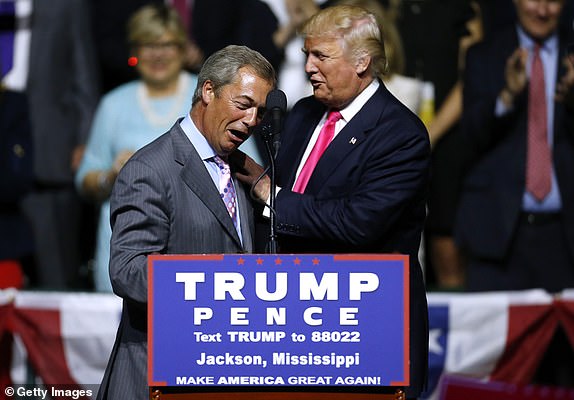 JACKSON, MS - AUGUST 24: Republican Presidential nominee Donald Trump, right, greets United Kingdom Independence Party leader Nigel Farage during a campaign rally at the Mississippi Coliseum on August 24, 2016 in Jackson, Mississippi. Thousands attended to listen to Trump's address in the traditionally conservative state of Mississippi. (Photo by Jonathan Bachman/Getty Images)