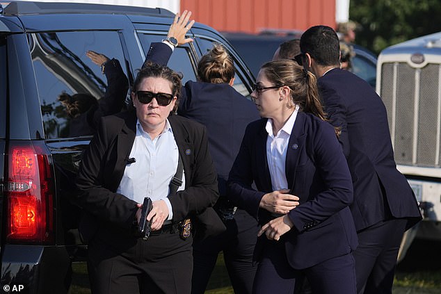 There appeared to be frantic scenes as the SUV drove Trump away