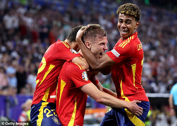 MUNICH, GERMANY - JULY 09: Dani Olmo of Spain celebrates scoring his team's second goal with teammate Lamine Yamal during the UEFA EURO 2024 Semi-Final match between Spain and France at Munich Football Arena on July 09, 2024 in Munich, Germany. (Photo by Alex Livesey/Getty Images)