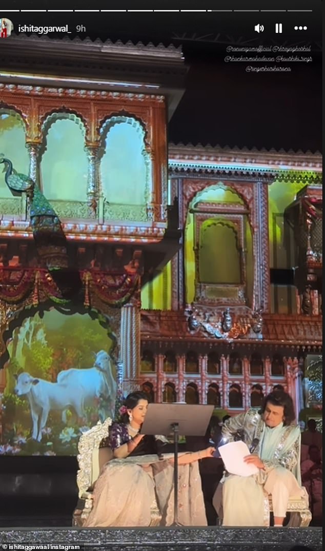 Figurines of peacocks and cows were on stage alongside wooden panels and houses to create a whole 'Ambani's world', while pictures of Hindu gods were also on display