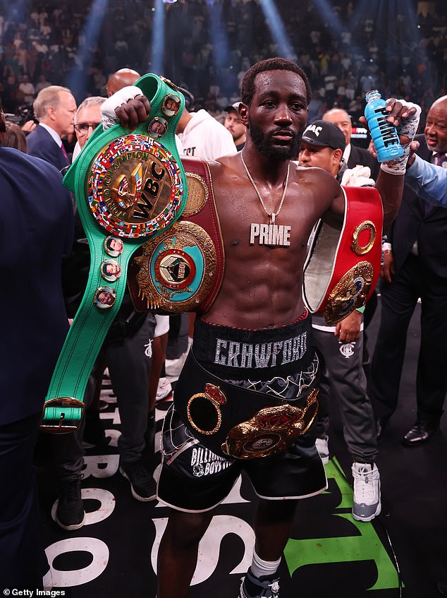 Crawford has his arm raised by Referee Harvey Dock after beating Errol Spence Jr. in 2023