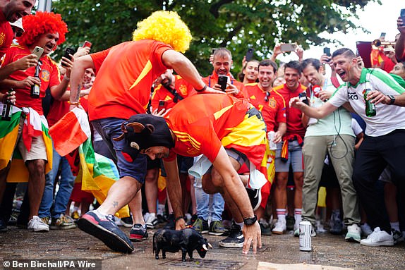 Spain fans with a plastic bull in Berlin, Germany, ahead of the UEFA Euro 2024 final between Spain and England later today. Picture date: Sunday July 14, 2024. PA Photo. See PA Story SOCCER England. Photo credit should read: Ben Birchall/PA WireRESTRICTIONS: Use subject to restrictions. Editorial use only, no commercial use without prior consent from rights holder.