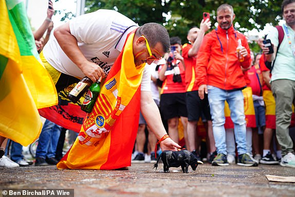 Spain fans with a plastic bull in Berlin, Germany, ahead of the UEFA Euro 2024 final between Spain and England later today. Picture date: Sunday July 14, 2024. PA Photo. See PA Story SOCCER England. Photo credit should read: Ben Birchall/PA WireRESTRICTIONS: Use subject to restrictions. Editorial use only, no commercial use without prior consent from rights holder.