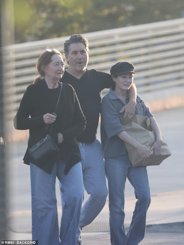 Shannen Doherty (right) and Chris Cortazzo (middle) are seen sharing affection as they leave Kristy's Malibu after dinner