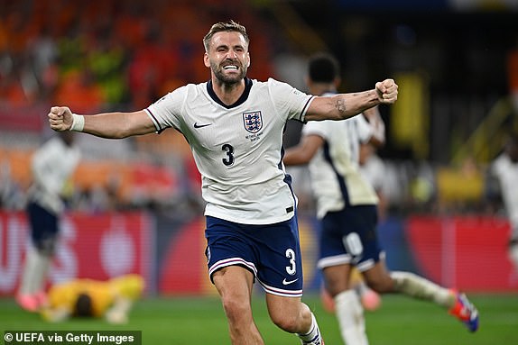 DORTMUND, GERMANY - JULY 10: Luke Shaw of England celebrates the winning goal by Ollie Watkins (not pictured) during the UEFA EURO 2024 semi-final match between Winner QF 3 and Winner QF 4 at Football Stadium Dortmund on July 10, 2024 in Dortmund, Germany. (Photo by Michael Regan - UEFA/UEFA via Getty Images)