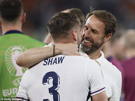 DORTMUND, GERMANY - JULY 10: Luke Shaw of England and Gareth Southgate, Manager of England celebrate after winning the UEFA EURO 2024 semi-final match between Netherlands and England at Football Stadium Dortmund on July 10, 2024 in Dortmund, Germany. (Photo by Richard Sellers/Sportsphoto/Allstar via Getty Images)