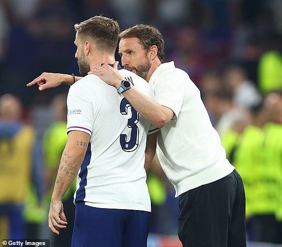 DORTMUND, GERMANY - JULY 10:  England Manager Gareth Southgate speaks to Luke Shaw of England during the UEFA EURO 2024 semi-final match between Netherlands and England at Football Stadium Dortmund on July 10, 2024 in Dortmund, Germany. (Photo by Chris Brunskill/Fantasista/Getty Images)