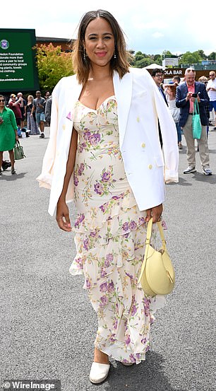 Zawe looked typically chic in a floral maxi dress, teamed with a white blazer and slip-on shoes