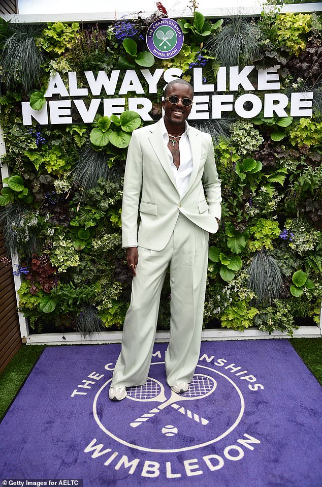 Vas J Morgan put on a stylish display in a cream suit and crisp white shirt, teamed with trainers and gold sunglasses