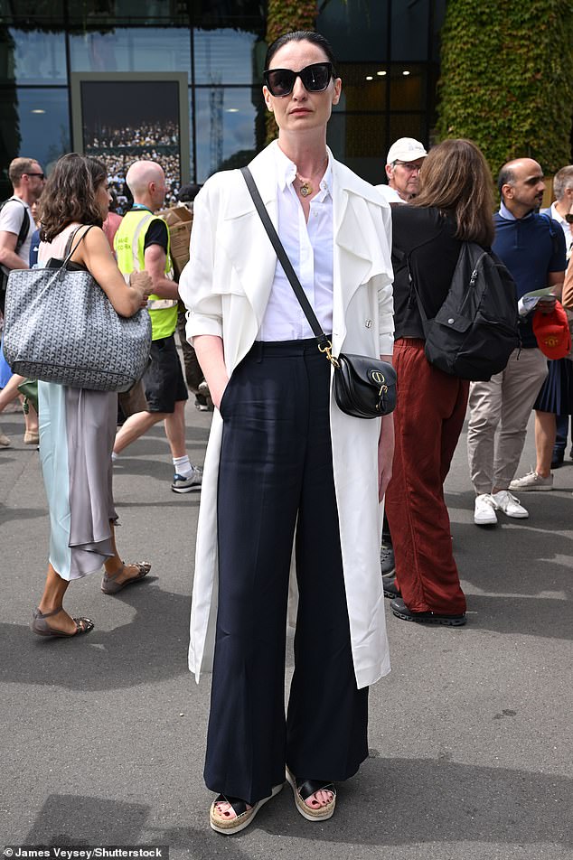 Erin O'Connor, also hosted by Champagne Lanson, wore a chic white trench coat and shirt, teamed with black trousers