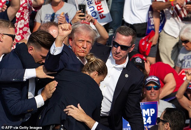 Trump was left bloodied and hurt during the assassination attempt on Saturday night. He managed to get on his feet with blood pouring down his cheek and raised his fist in the air and defiantly shouted 'fight'