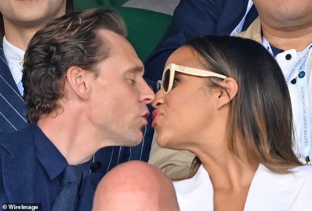 The couple shared a kiss after taking to their seats on day fourteen of Wimbledon