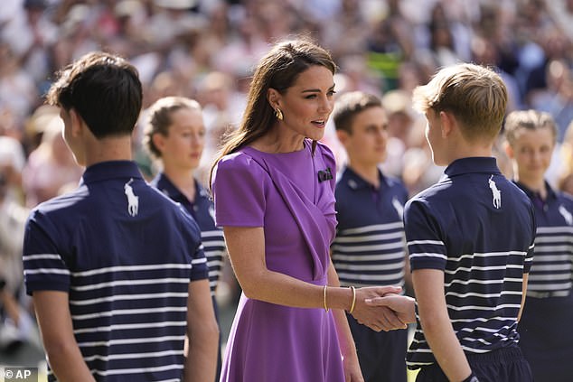 Princess of Wales meets a ball boy after the men's singles final