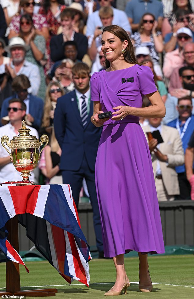 Princess of Wales presents the winner's trophy to Spain's Carlos Alcaraz after beating Serbia's Novak Djokovic during their men's singles final