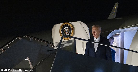 US President Joe Biden steps off Air Force One at Andrews Air Force Base in Lanham, Maryland, on July 14, 2024. US President Joe Biden led the condemnation after his election rival Donald Trump was wounded in a shooting incident at a rally in Pennsylvania July 13 that also reportedly killed at least one bystander. Political leaders on both sides of the aisle slammed the violence minutes after the Republican candidate was rushed off stage by the Secret Service, blood running down his face. (Photo by SAMUEL CORUM / AFP) (Photo by SAMUEL CORUM/AFP via Getty Images)