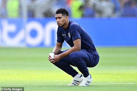 BERLIN, GERMANY - JULY 14: Jude Bellingham of England looks on as he inspects the pitch prior to the UEFA EURO 2024 final match between Spain and England at Olympiastadion on July 14, 2024 in Berlin, Germany. (Photo by Dan Mullan/Getty Images)