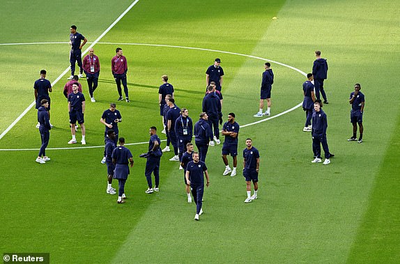 Soccer Football - Euro 2024 - Final - Spain v England - Berlin Olympiastadion, Berlin, Germany - July 14, 2024 England's Kyle Walker, Harry Kane and Kieran Trippier with teammates on the pitch before the match REUTERS/Annegret Hilse