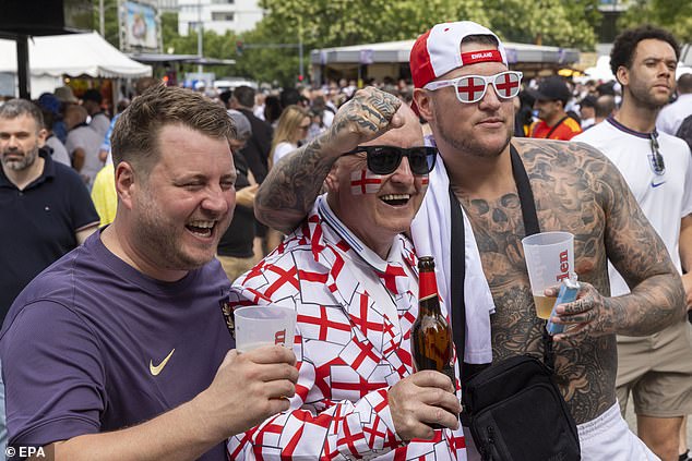 England football fans display their George Cross