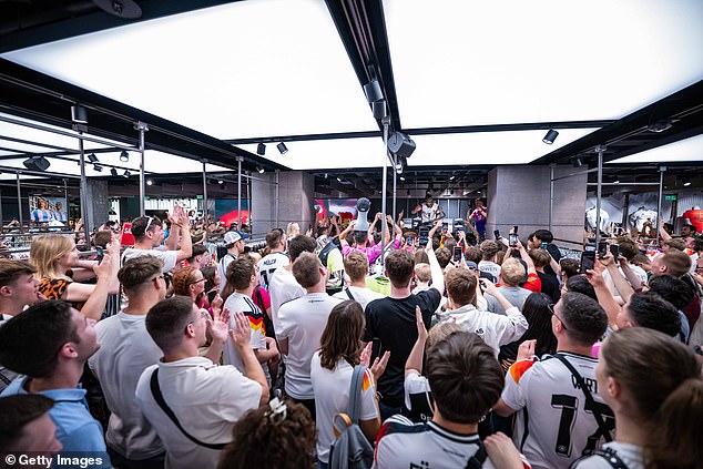 German saxophonist Andre Schnura performs at the adidas Flagship Store in Berlin ahead of the UEFA EURO 2024 final