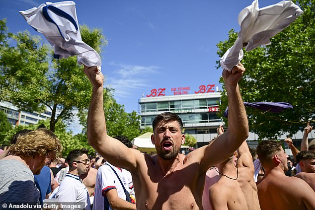 A British fan waving his football shirt in the air ahead of the match tonight