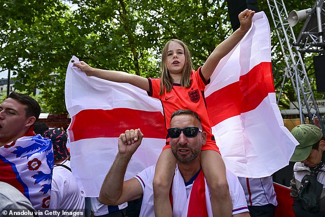 British football fans gather and chant slogans as they wait for the UEFA EURO 2024 final