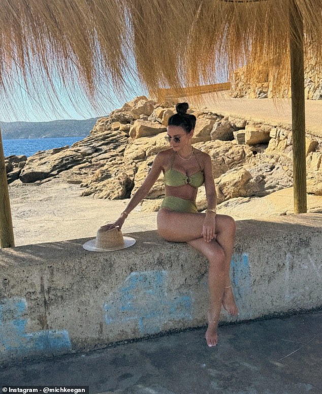 The Brassic star styled her long dark tresses in a high bun and donned a pair of sunglasses as she sat on a wall at the beach in another picture