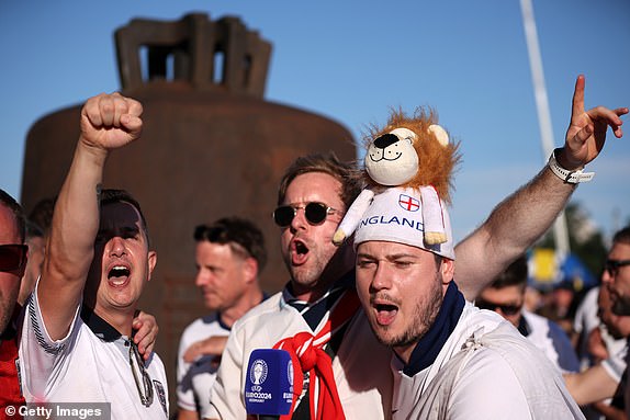 BERLIN, GERMANY - JULY 14: Fans of England react as they speak with the media on the outside of the stadium prior to the UEFA EURO 2024 final match between Spain and England at Olympiastadion on July 14, 2024 in Berlin, Germany. (Photo by Alex Grimm/Getty Images)