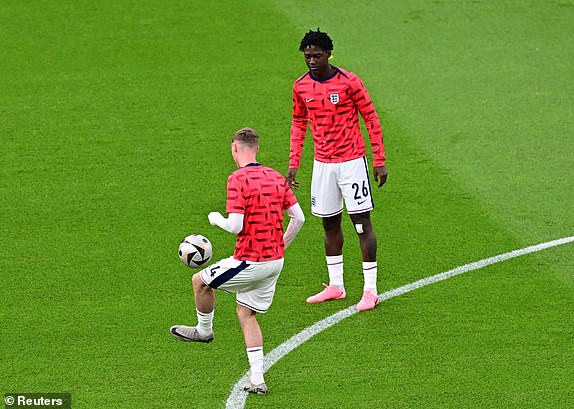 Soccer Football - Euro 2024 - Final - Spain v England - Berlin Olympiastadion, Berlin, Germany - July 14, 2024 England's Cole Palmer and Kobbie Mainoo during the warm up before the match REUTERS/Angelika Warmuth