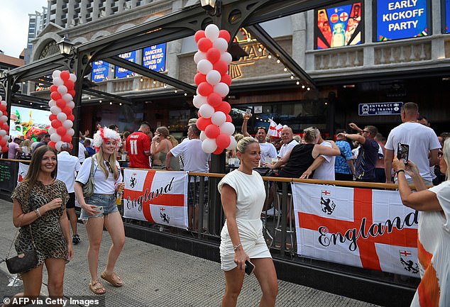 England fans cheer prior the UEFA Euro 2024 finale football match between Spain and England, in Benidorm