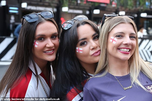 Three young England fans don their Three Lions and wear the George Cross in support