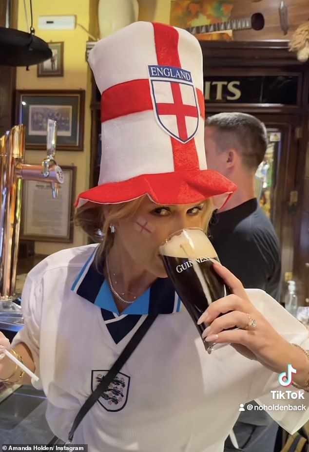 Amanda Holden, 53, sipped on a pint of Guinness in a football shirt and novelty hat to cheer on England ahead of the nail-biting Euros 2024 final in Spain on Sunday