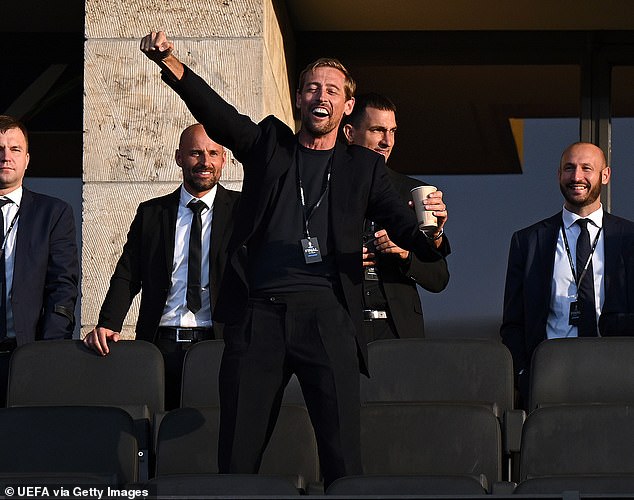 Martin and Roman arrived alongside former footballer Peter Crouch (seen) who threw his arms in the air while he patiently waited for kick off