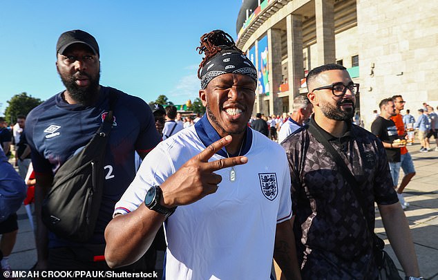 KSI threw up a peace sign as he posed with friends outside UEFA Euros in his white and blue England shirt