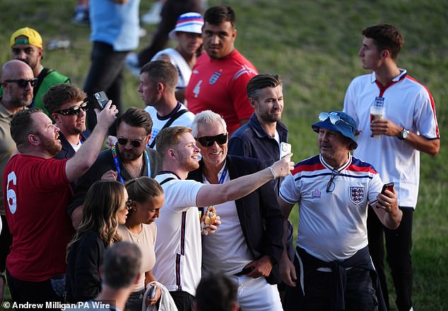 The father-son duo appeared in high-spirits as they made their way into the stadium ahead of the nail-biting match