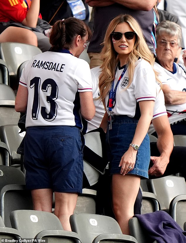 Georgina Irwin (right), wife of England goalkeeper Aaron Ramsdale seen arriving in the stands in Berlin