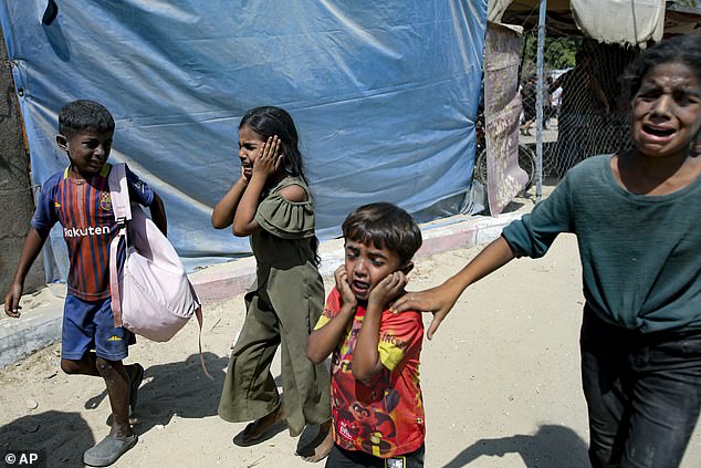 Palestinian children are evacuated from a site hit by an Israeli bombardment on Khan Younis, southern Gaza Strip, Saturday, July 13, 2024