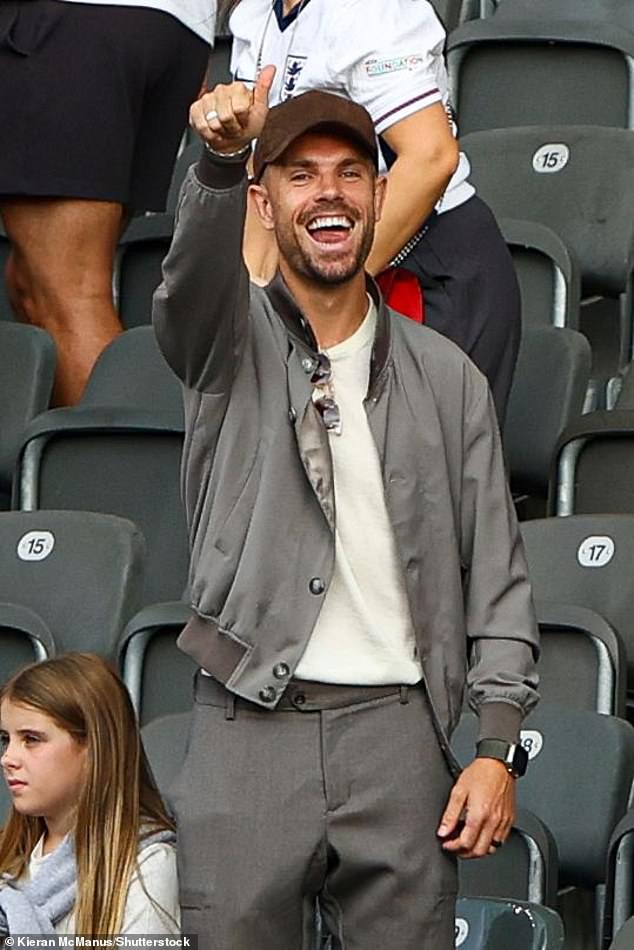 English footballer Jordan Henderson put his thumb up as he watched in the stands