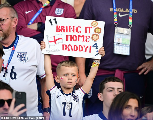 Phil Foden's influencer son Ronnie, five, was among the Three Lions' 'cubs' cheering on the team with his adorable homemade sign