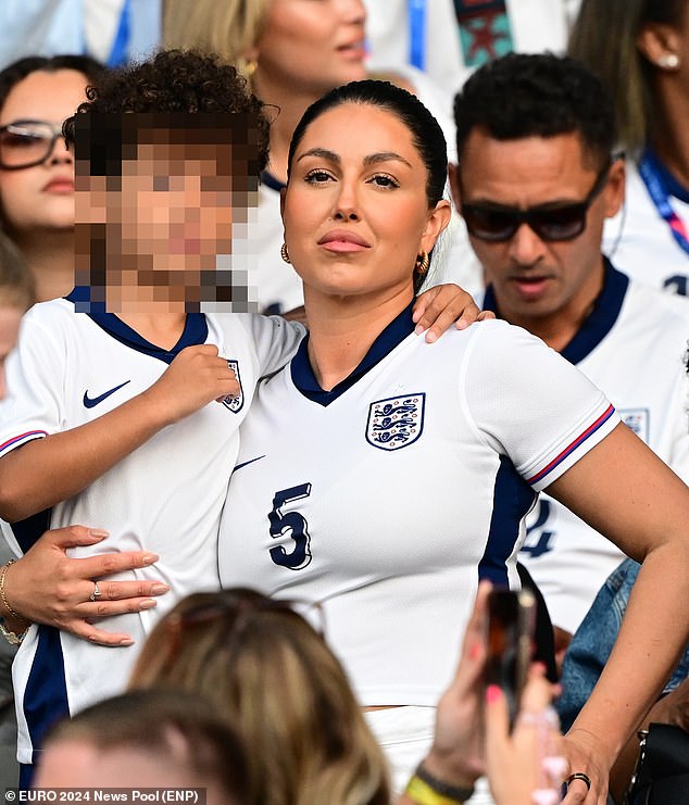 Olivia Naylor even posed with her hand on her hip, as she joined the crowds to support John Stones