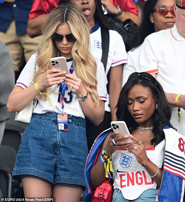 Tolami Benson - girlfriend of Bukayo Saka - appeared to be scrolling through her phone as the match approached half time