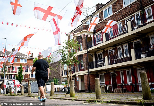 England flags painted and hanging across the Kirby Estate for the Euros