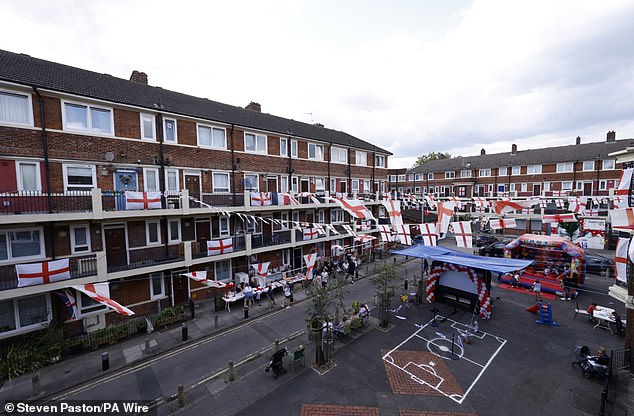 The estate is a sea of red and white as more than 350 England flags hung from balconies and bunting ran across every building